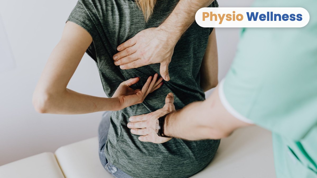 Chiropractor performing a hands-on spinal assessment on a patient in Etobicoke.