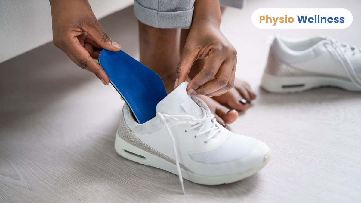 Hands placing a custom orthotic insole into a running shoe