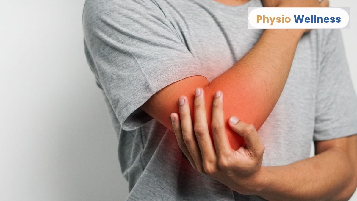 Man holding the outside of his elbow from tennis elbow pain, Physio Wellness Etobicoke