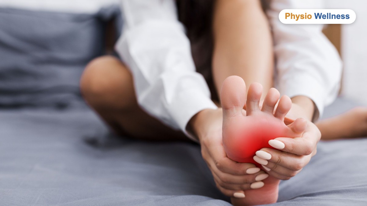 Person holding the ball of the foot in pain from a Morton neuroma
