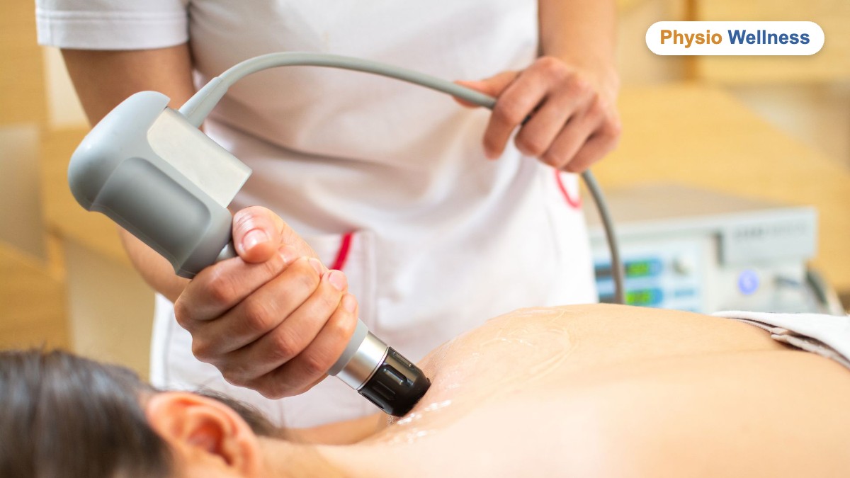 Physiotherapist delivering shockwave therapy to a patient at Physiotherapy Wellness Inst in Etobicoke