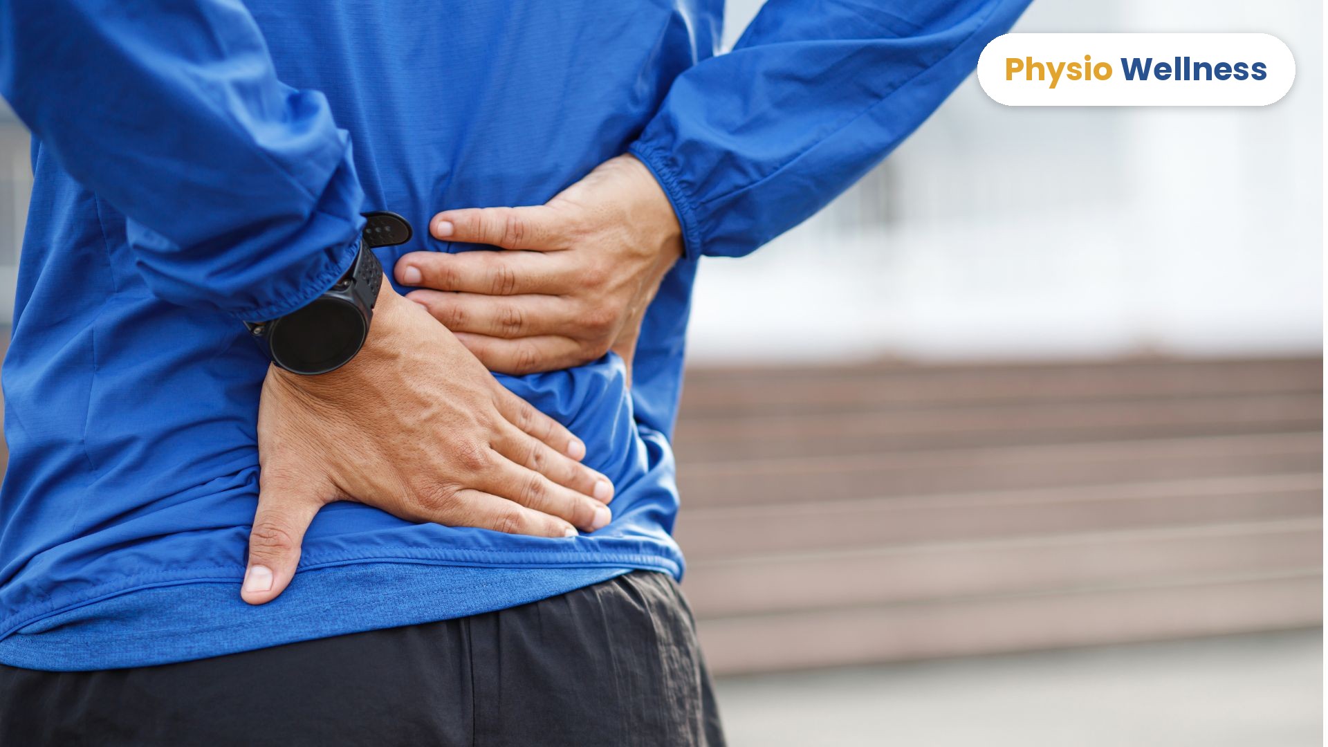 Man holding his lower back, a common lower back pain symptom